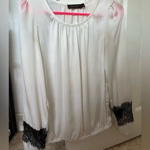 Sheer white long sleeve blouse with black lace detail